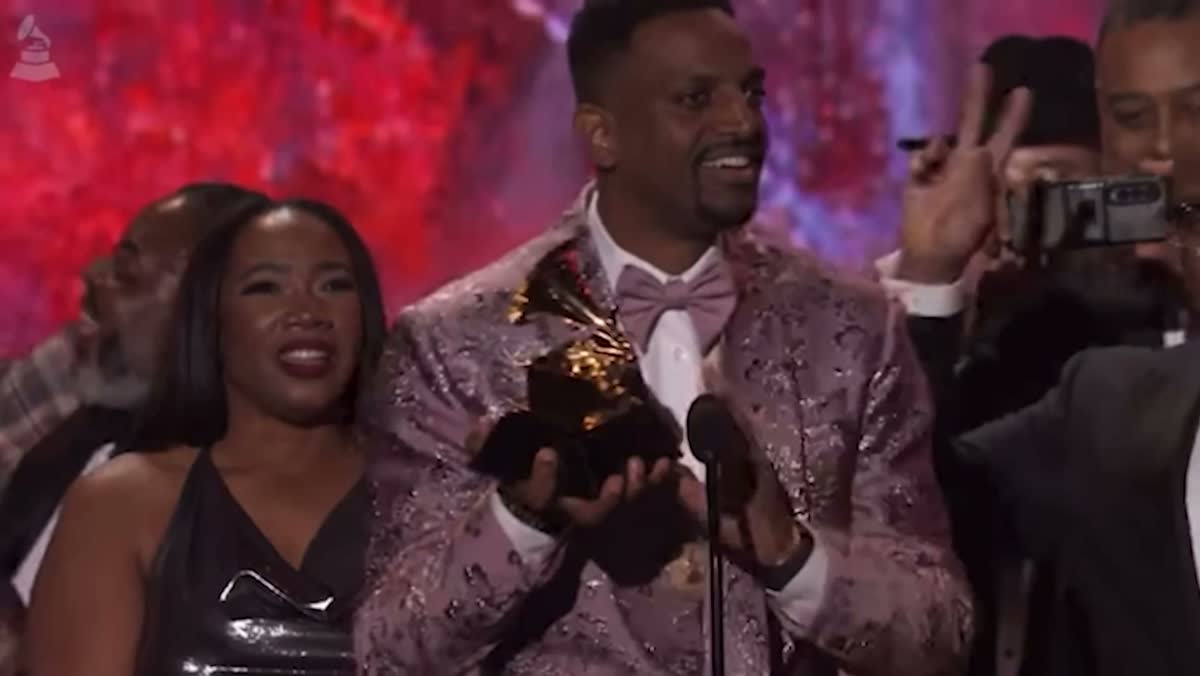 J. Ivy accepting a GRAMMY Award, Tarrey Torae beside him
